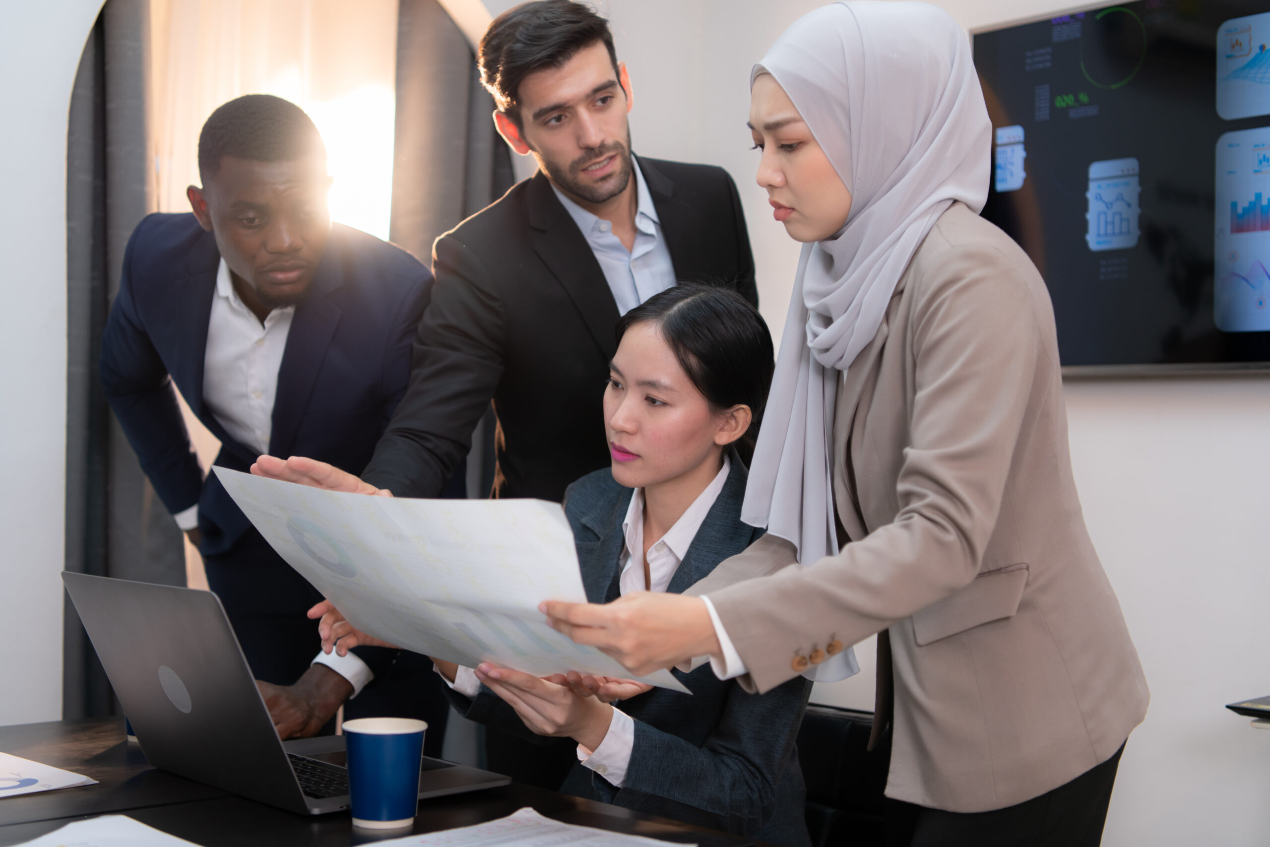 Multiethnic group of business people working together in a modern office